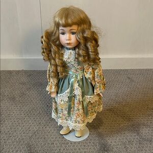 Vintage Style Porcelain Doll with Curly Hair